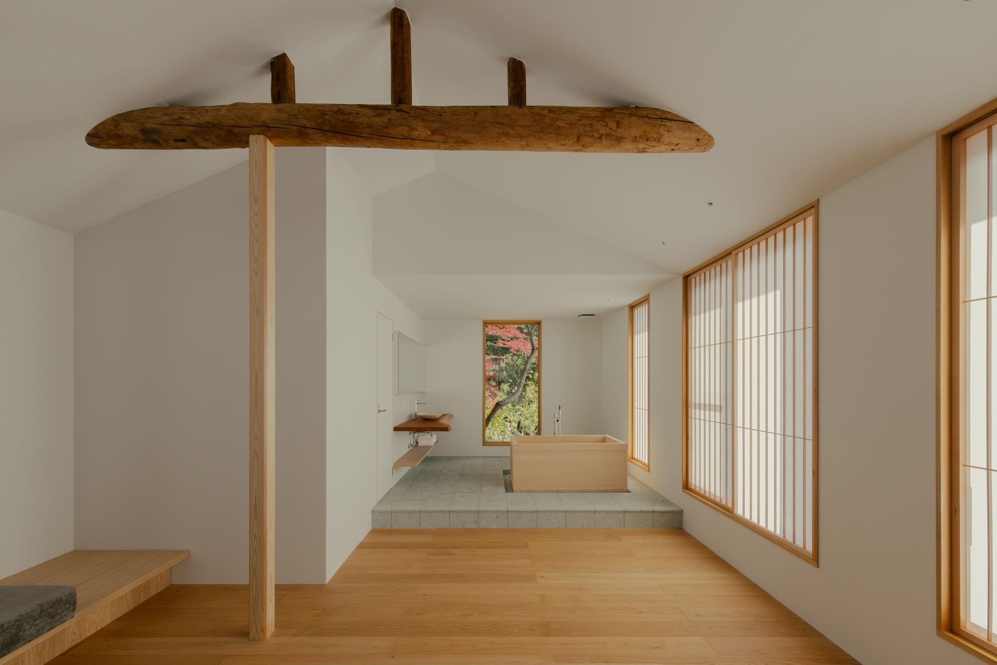 Exterior view of House in Narutaki, showcasing its wooden facade and integration with the surrounding natural landscape.