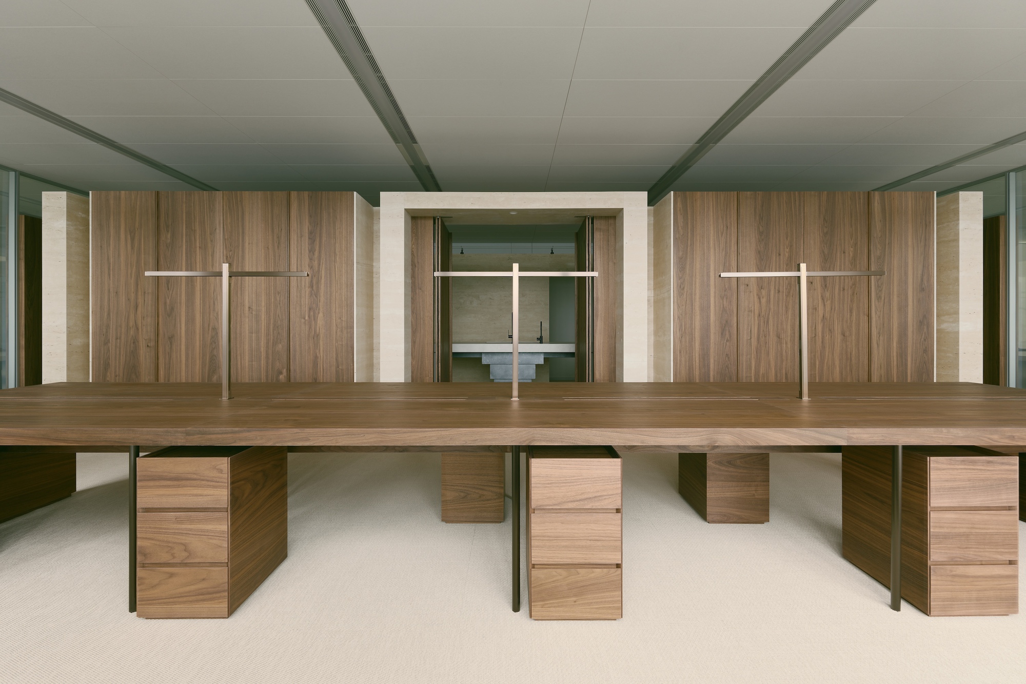 Interior view of Office H by Minuspluse Design, showcasing a central interaction lounge and natural light.