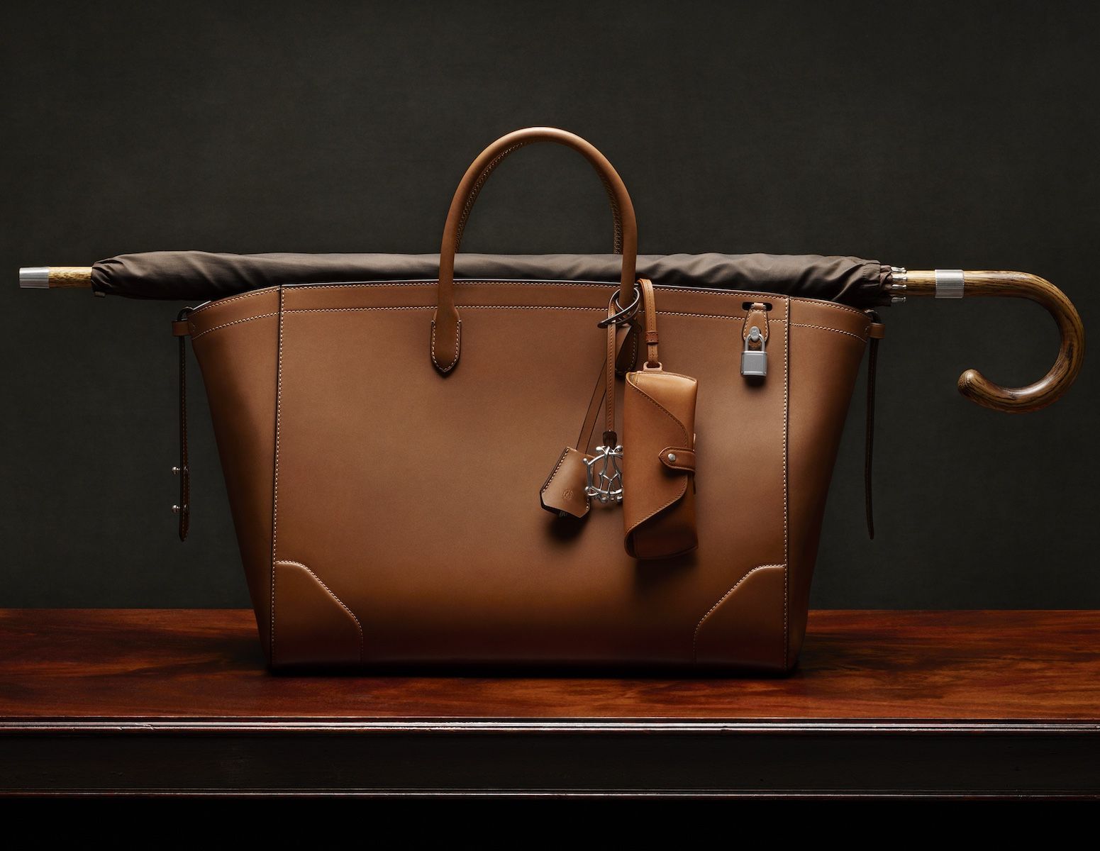 A photograph of the Dunhill Century Tote 33 bag, showcasing its clean lines and leather construction.