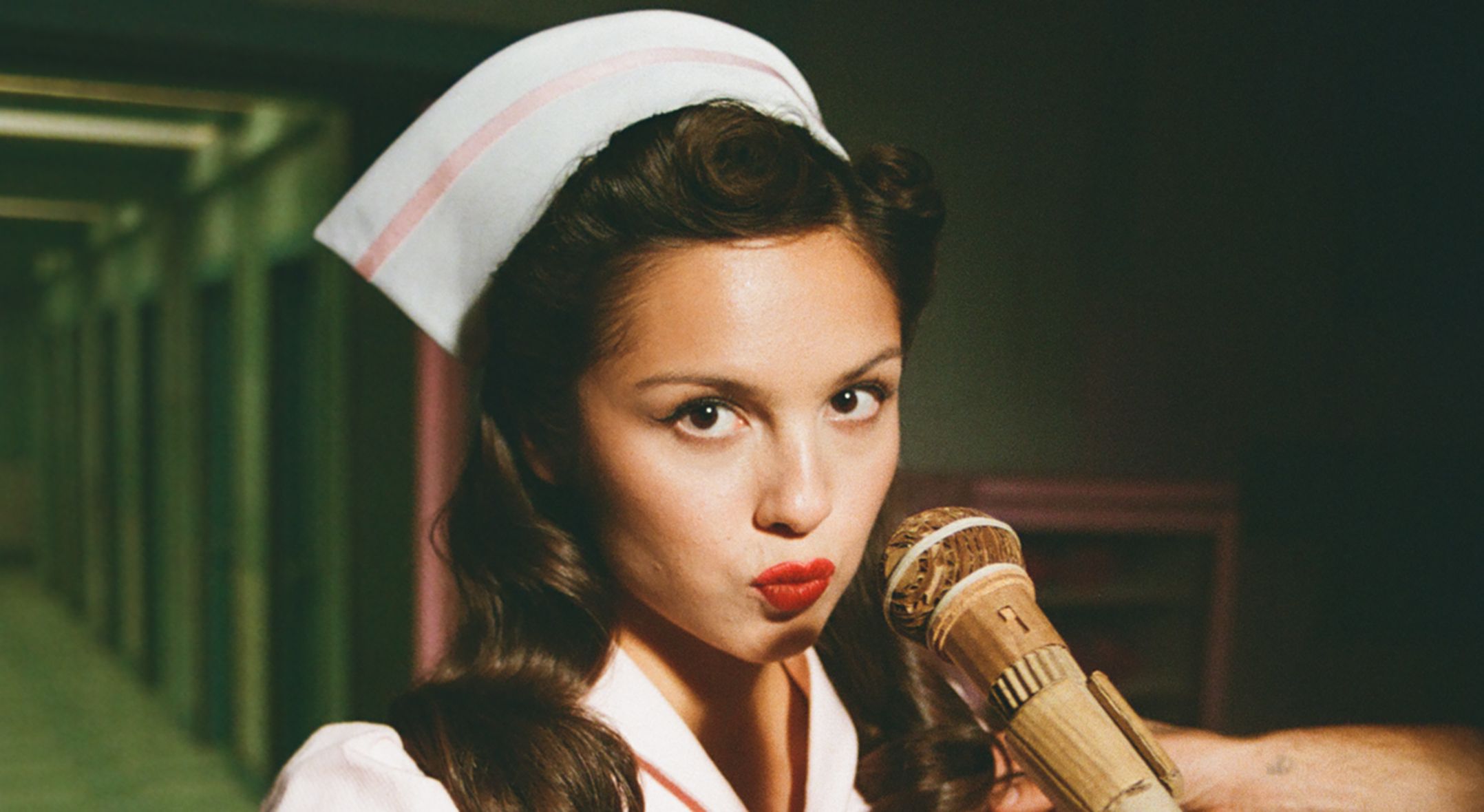 Olivia Rodrigo in a hospital-themed music video set constructed from arts and crafts materials.