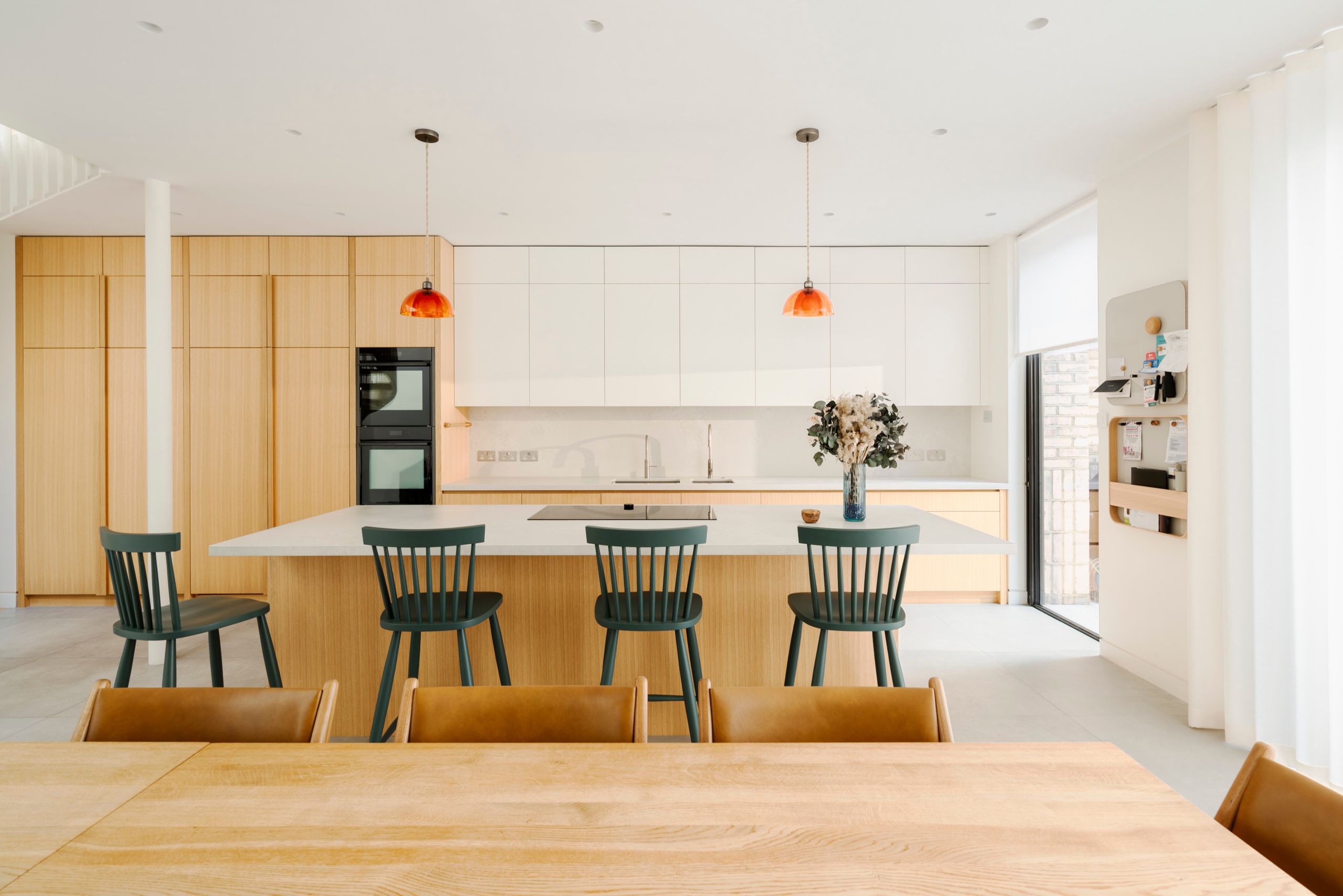 Interior view of the renovated Edwardian house, highlighting the bespoke metal staircase and open-plan living space.