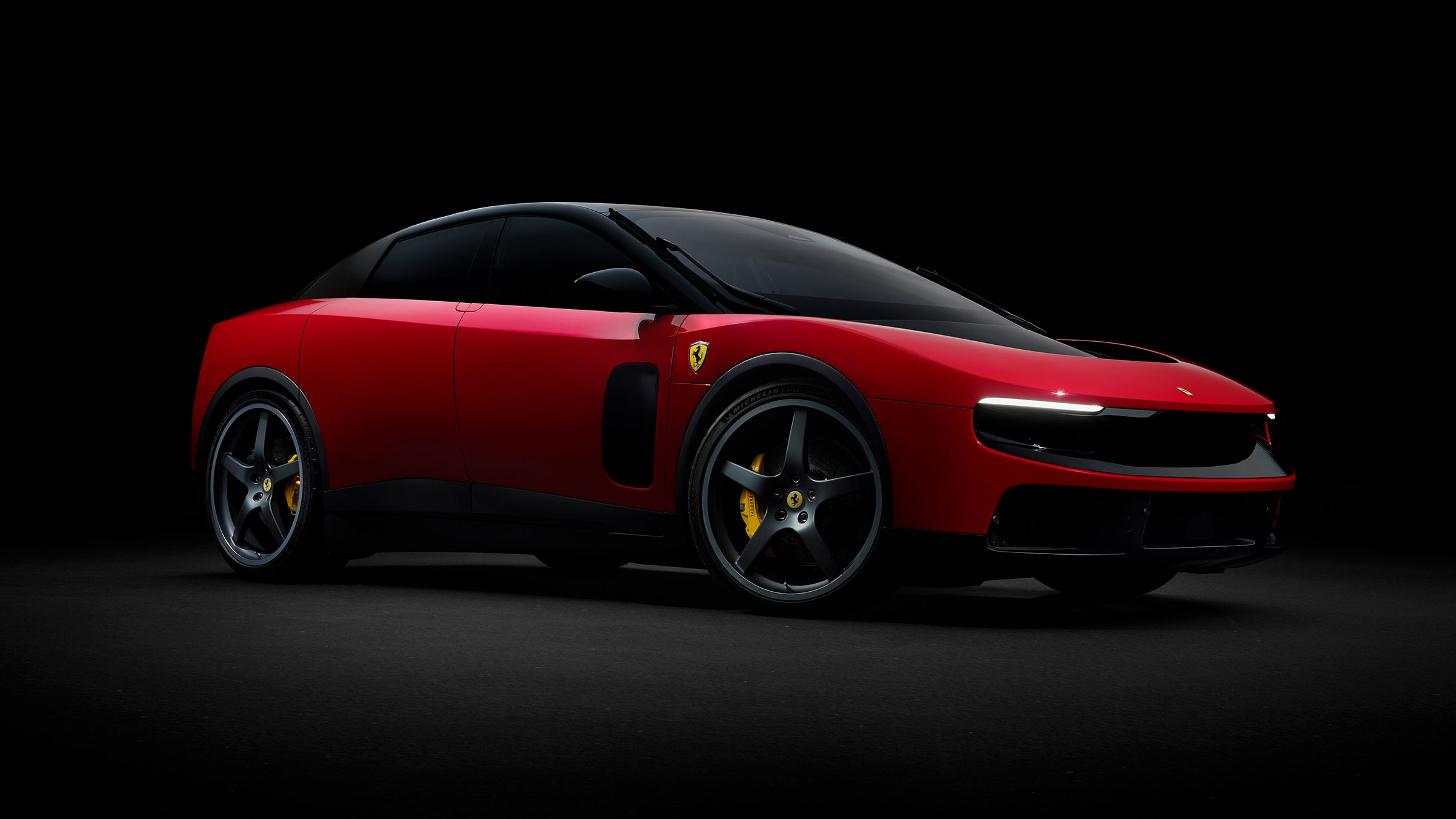 Side profile of the Ferrari Luce electric sports car, showcasing its sweeping glasshouse and aerodynamic aluminum body panels.