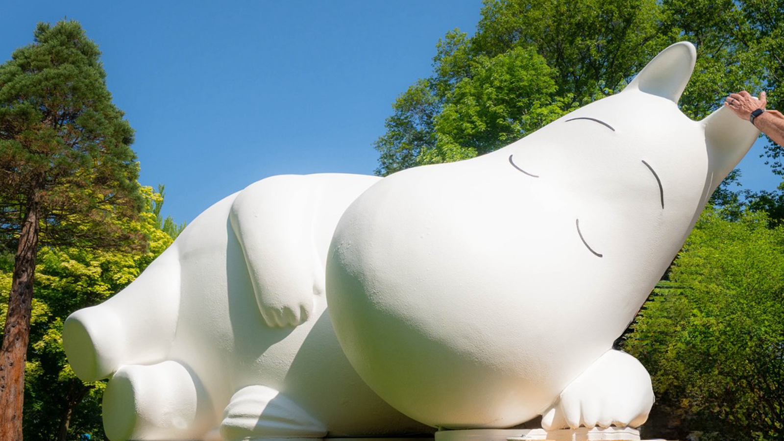 Visitors interacting with Moomin-themed installations in the Everett Children's Adventure Garden at the New York Botanical Garden