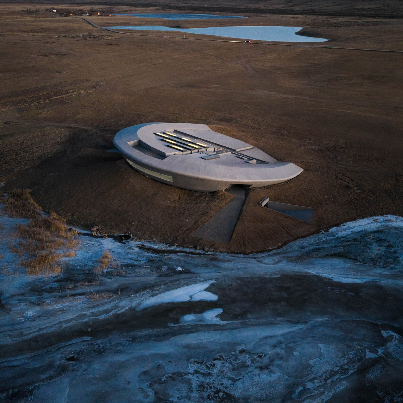 The Prairie Ark Gallery, a futuristic flying saucer-shaped building on the shores of Laoli Lake in Inner Mongolia.