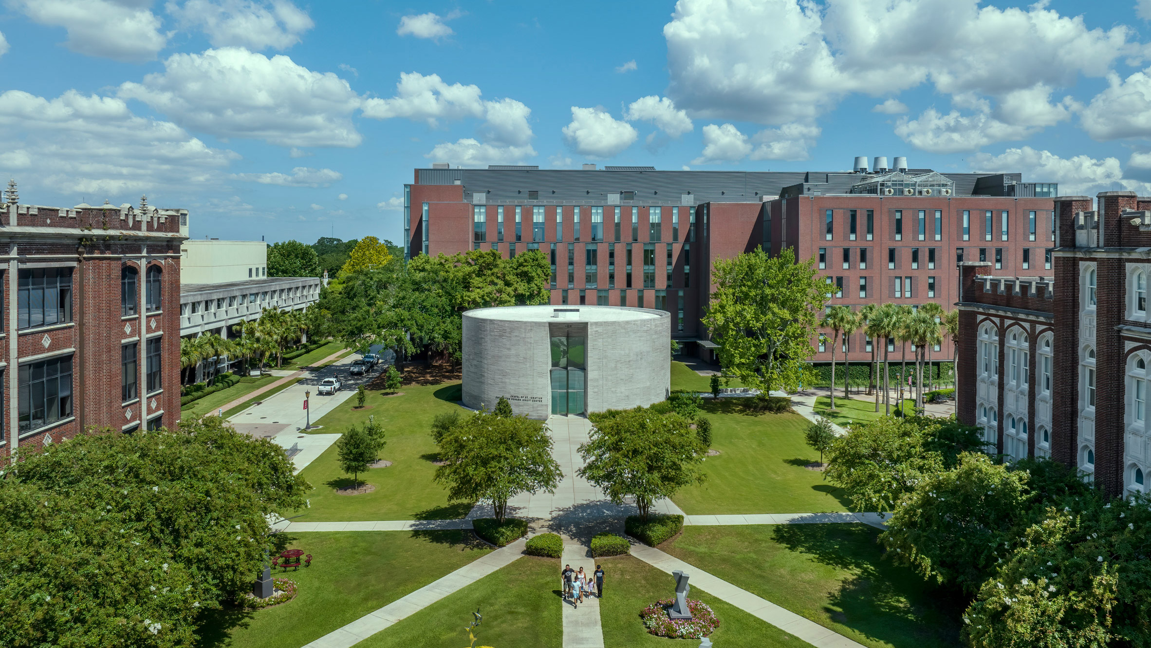 Exterior view of the circular Chapel of St. Ignatius at Loyola University, New Orleans, with its handmade brick facade.