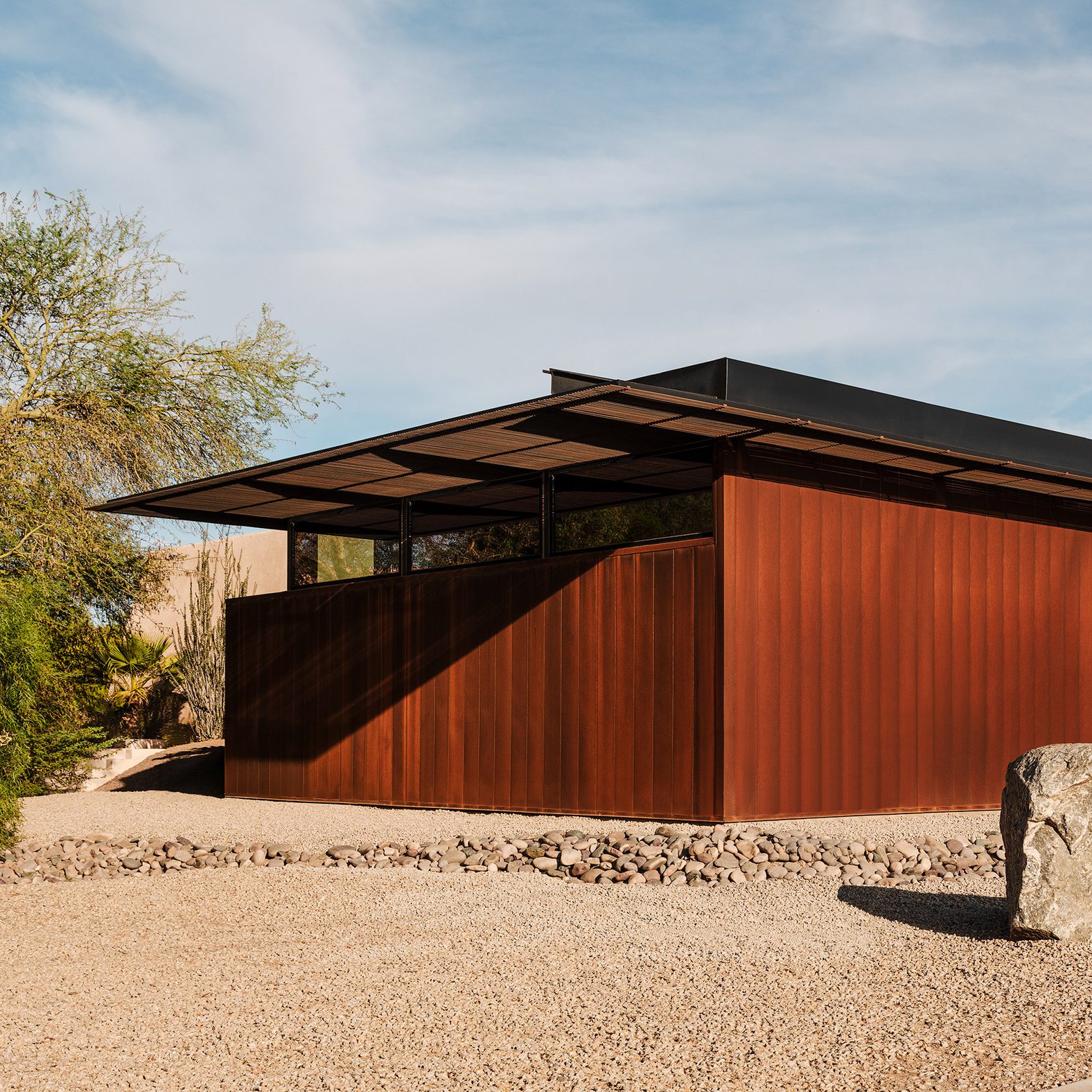 Exterior view of the Cocopah Museum and Cultural Center expansion, showcasing its weathering steel facade and flat roof.