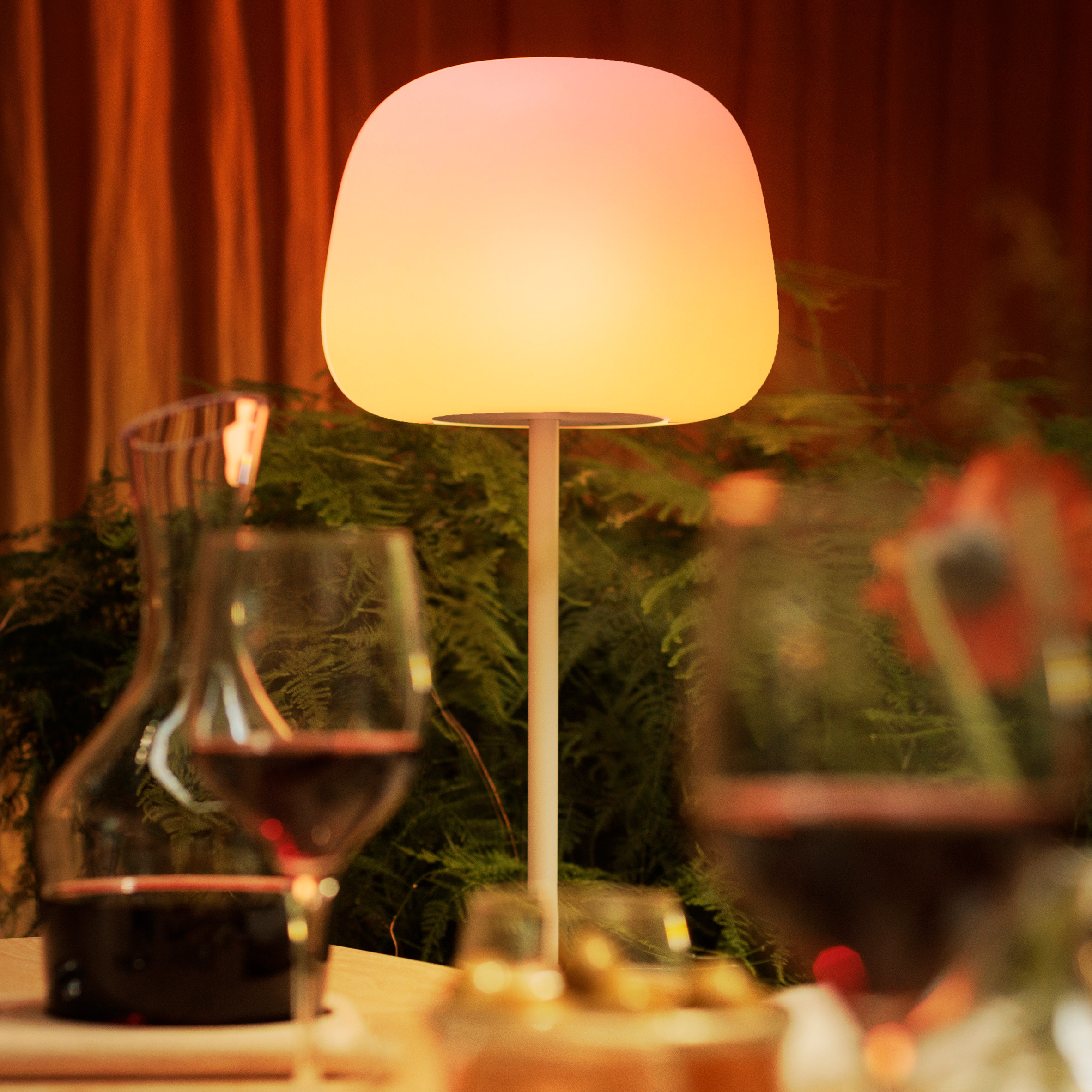Govee Lantern Floor Lamp with a rounded illuminated diffuser on a slim cylindrical stem, placed in a modern interior setting.