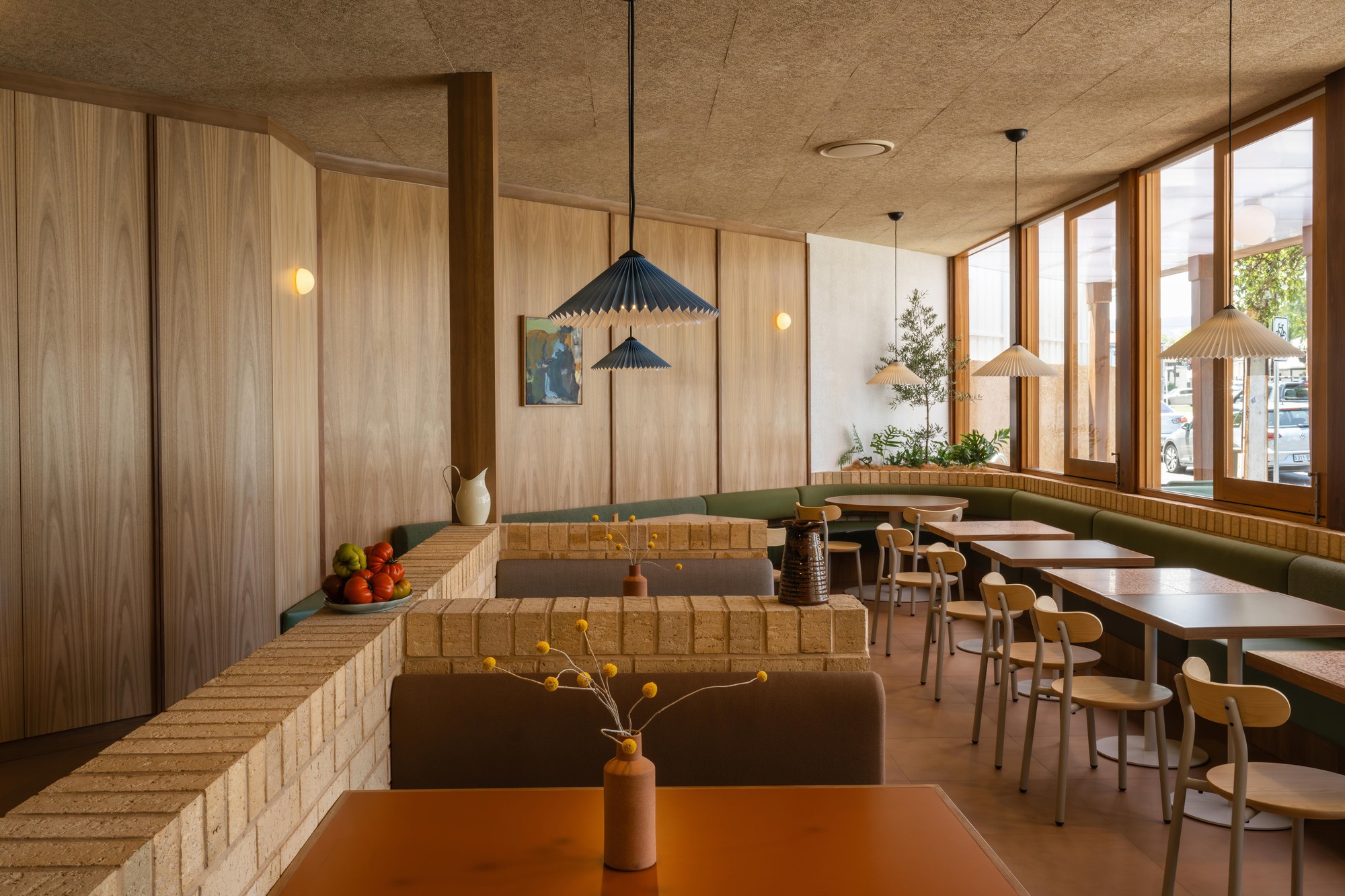 Exterior view of Mensa Kitchen, showcasing its integration with the existing warehouse structure.