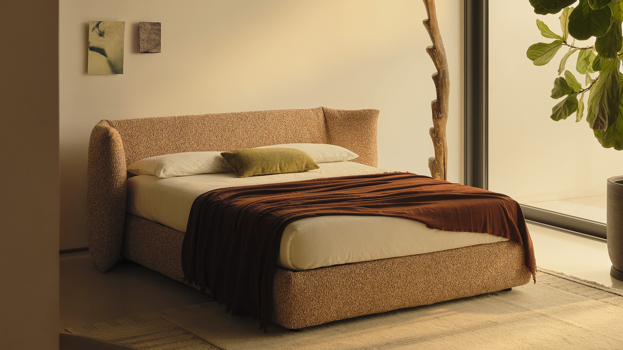 The Awase bed by Omi Tahara for Bolzan, featuring a solid ash wood frame, a low platform base with concealed storage, and a tightly woven rattan headboard, set in a minimalist