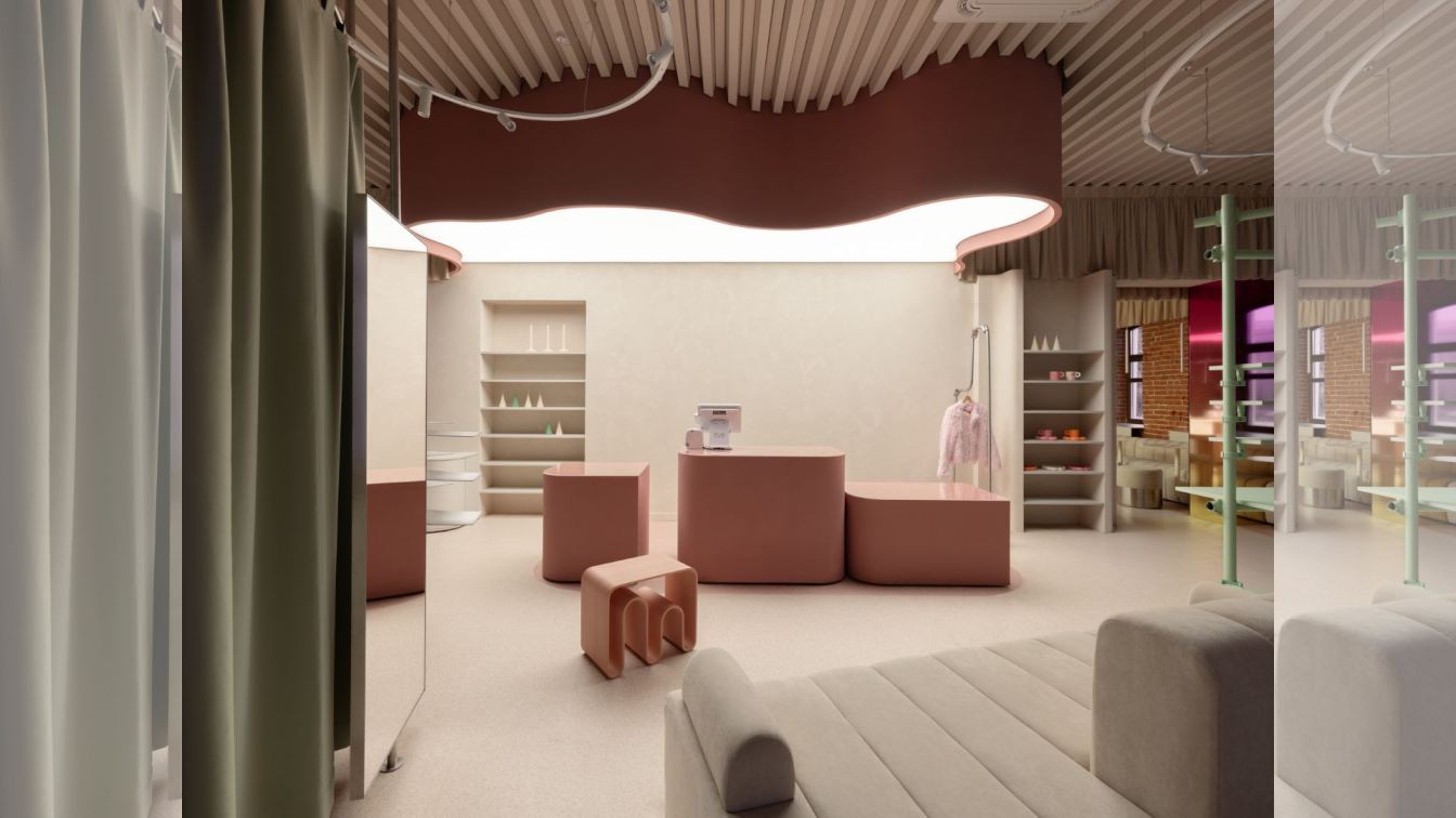 Interior view of the Vokrug Podrug café and concept store, showcasing a dominant pink color scheme, unique furniture, and architectural details.