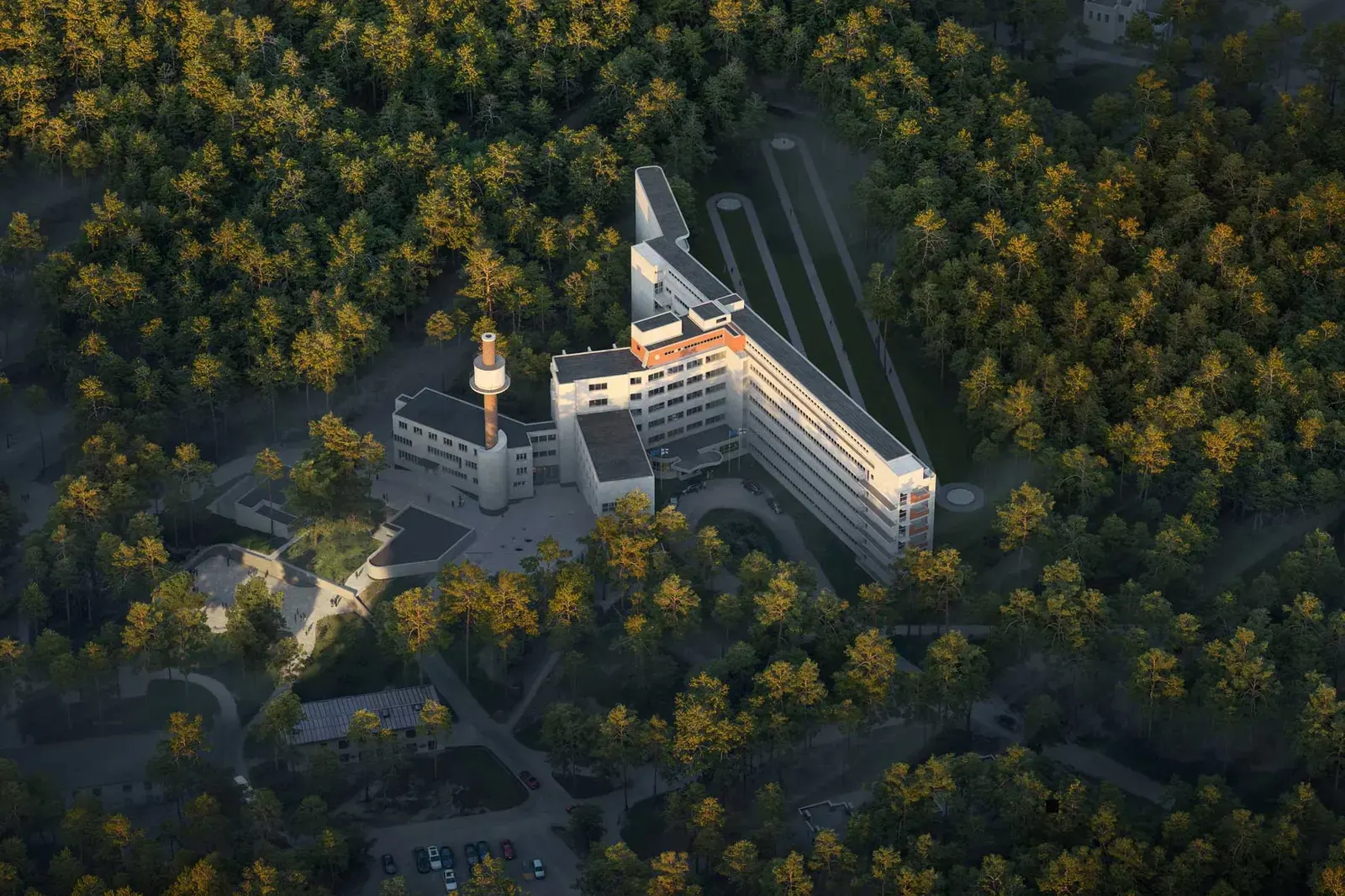 Exterior view of the Paimio Sanatorium, showcasing its modernist architecture, with architectural renderings indicating a new rear entrance and updated landscape design.