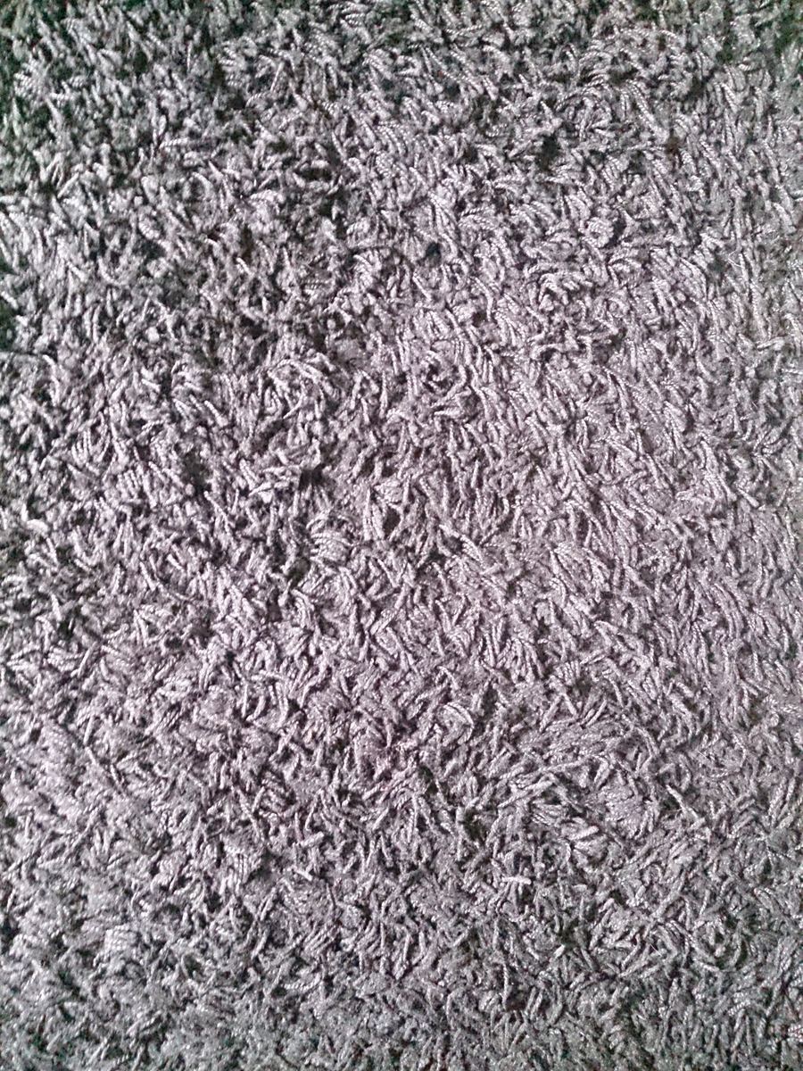 A close-up of a rug from Armadillo's Meridian collection, showcasing its natural fiber texture.