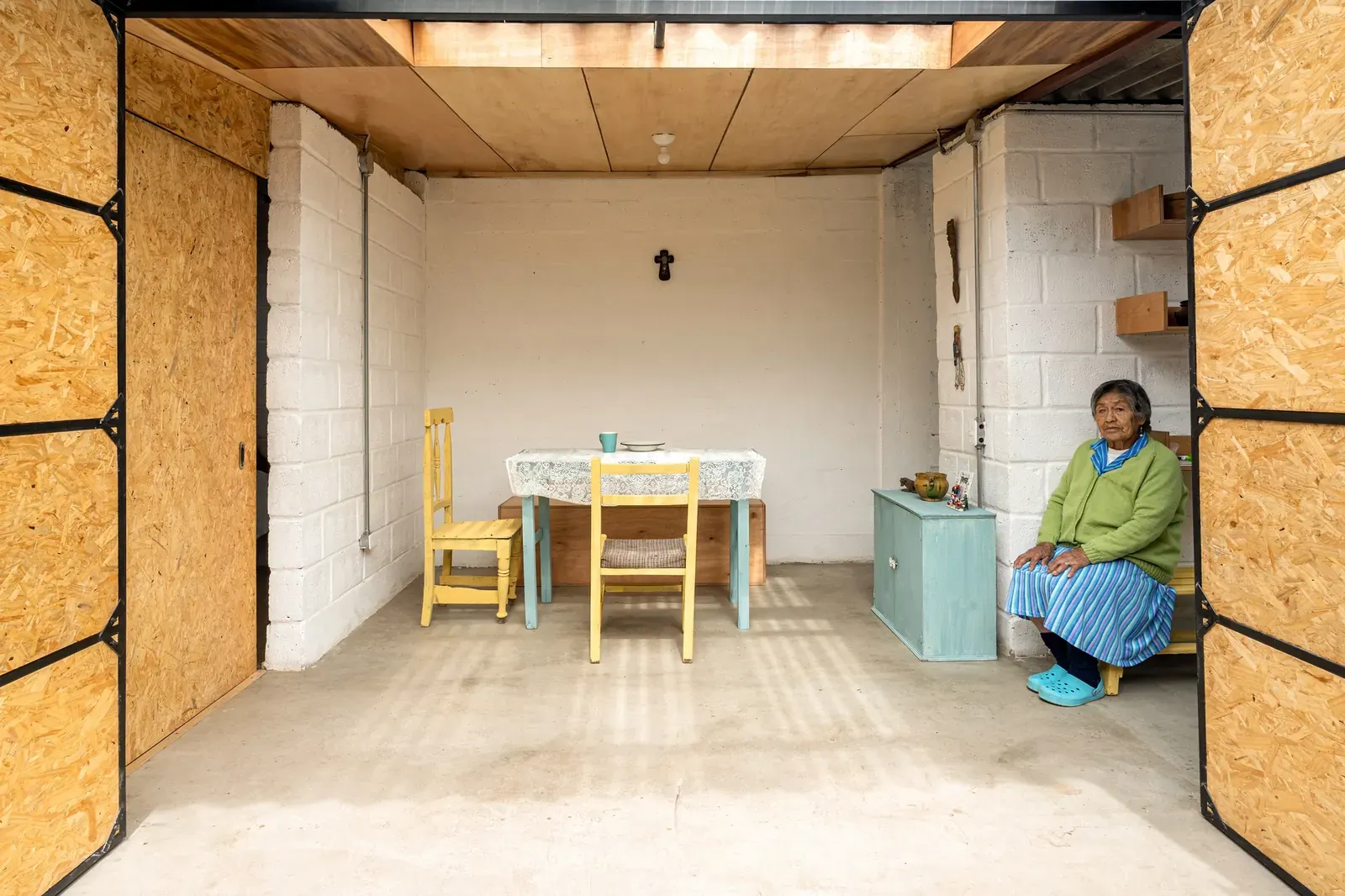 Exterior view of a modest, functional house built for María in Quito's La Gatazo neighborhood.