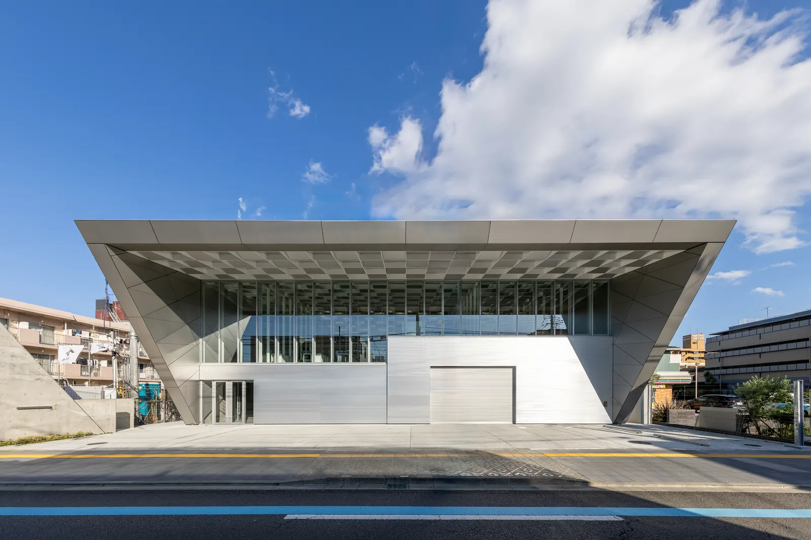 Exterior view of the Osaka Lightning Rod Industry Sendai Branch Office, showcasing its modern steel structure.