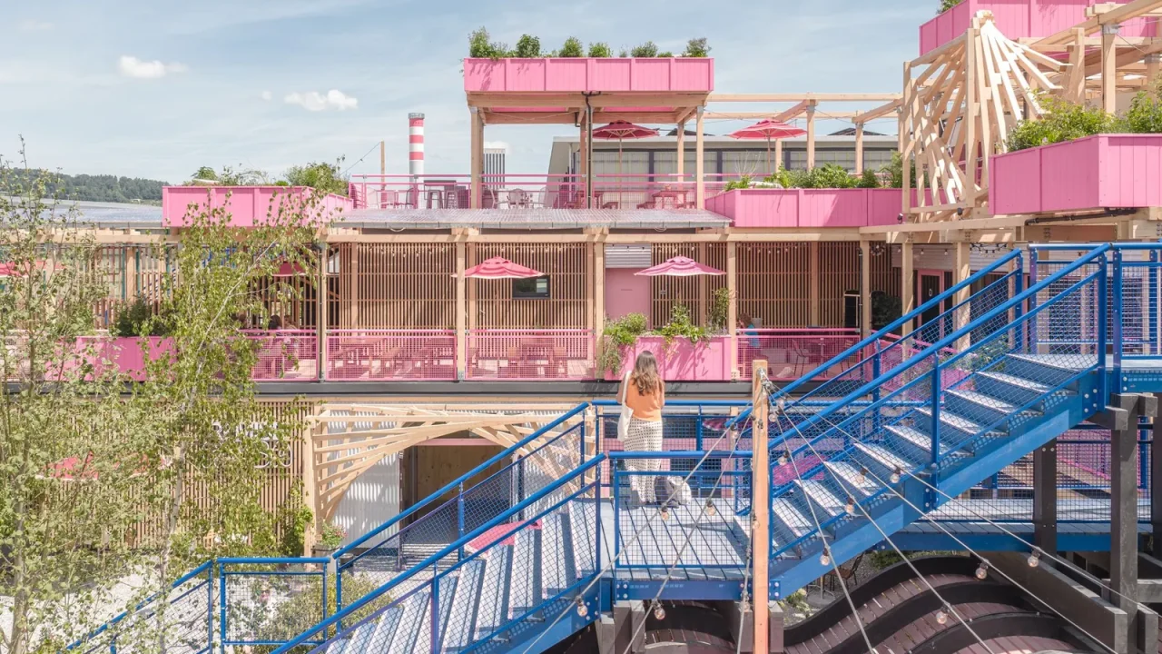 Hello Wood Unveils Vibrant Pink Timber Complex on Former Zurich Railway Site