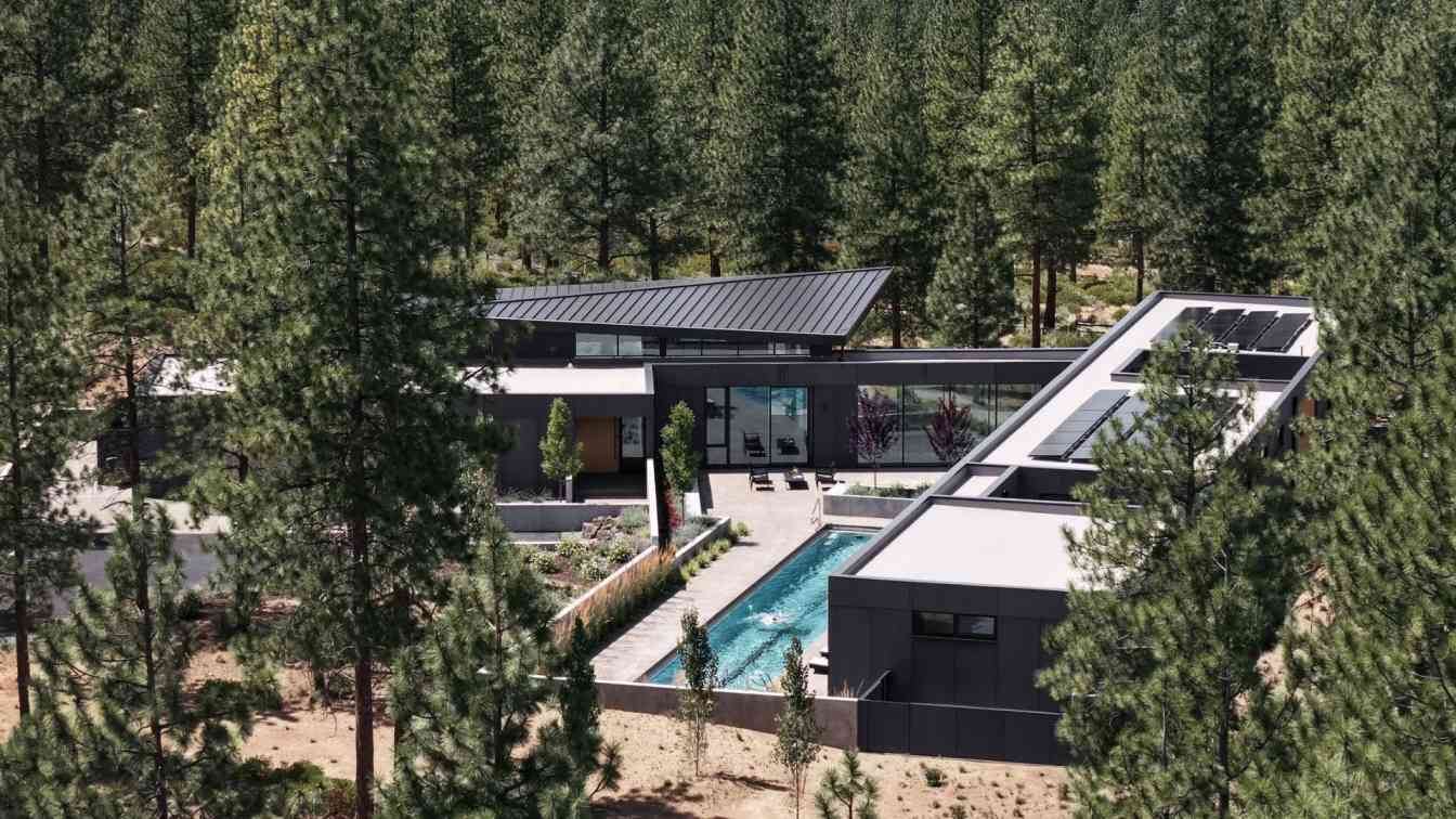 Exterior view of the Bend Hideaway residence by Feldman Architecture, showcasing its modern design nestled within a natural landscape.