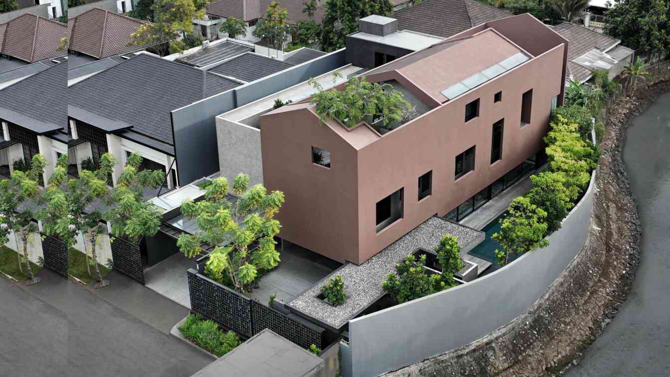 The contemporary exterior of El House in Jakarta, featuring a unique layered facade and a tranquil reflective pond.