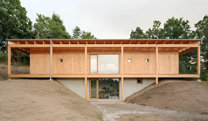 Atrium-Centered Timber House Unfolds Under Sweeping Roof in Denmark’s Glacial Landscape