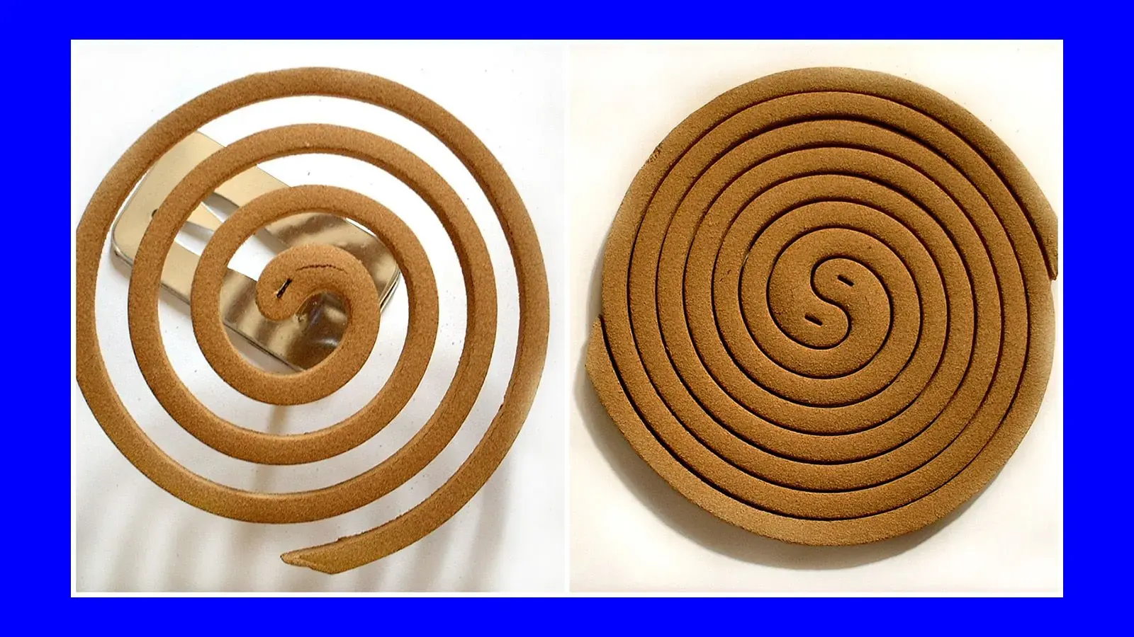 A lit, spiraled mosquito coil emitting smoke, placed on an outdoor surface.