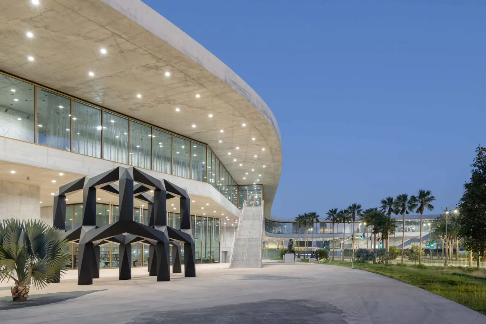 Exterior view of LACMA's David Geffen Galleries, showcasing its massive concrete structure and horizontal design.