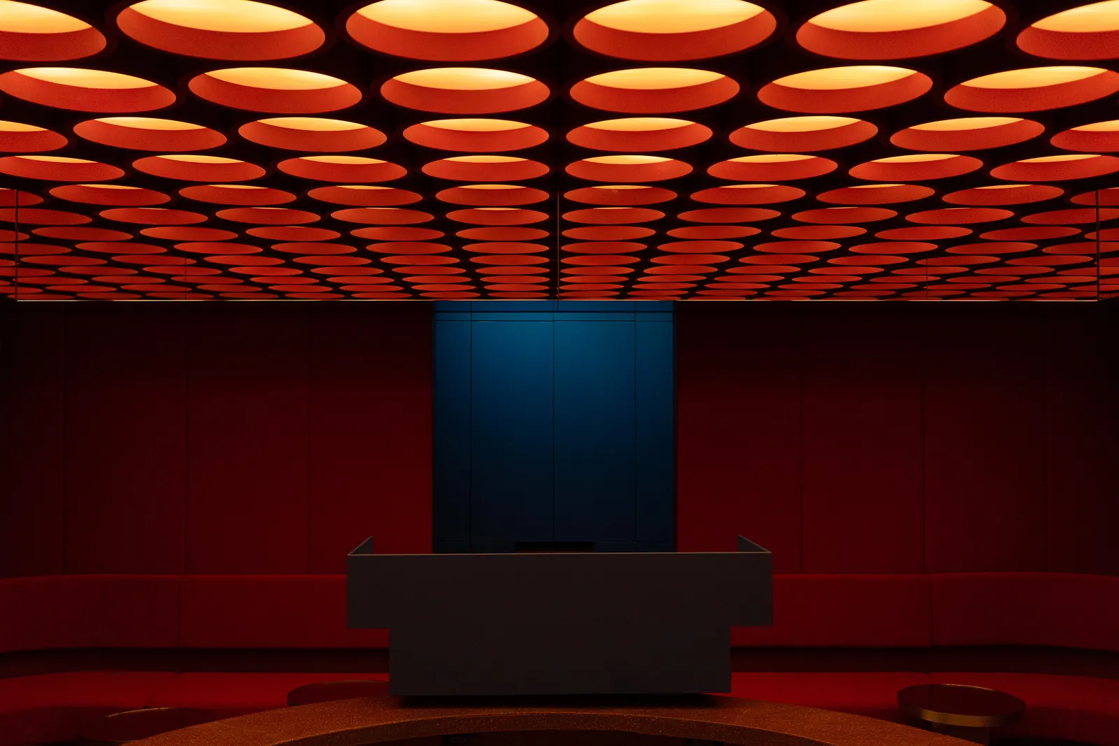 Interior of Rosso listening bar, featuring warm wood paneling, comfortable seating, and ambient lighting.
