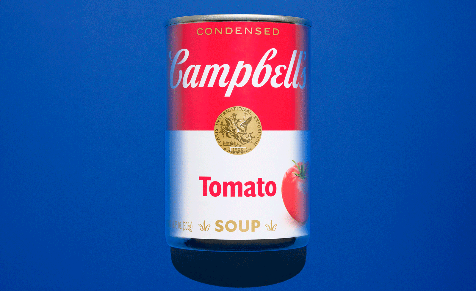 A display of multiple Andy Warhol Campbell's Soup Can artworks, showcasing the repetition of the iconic design.