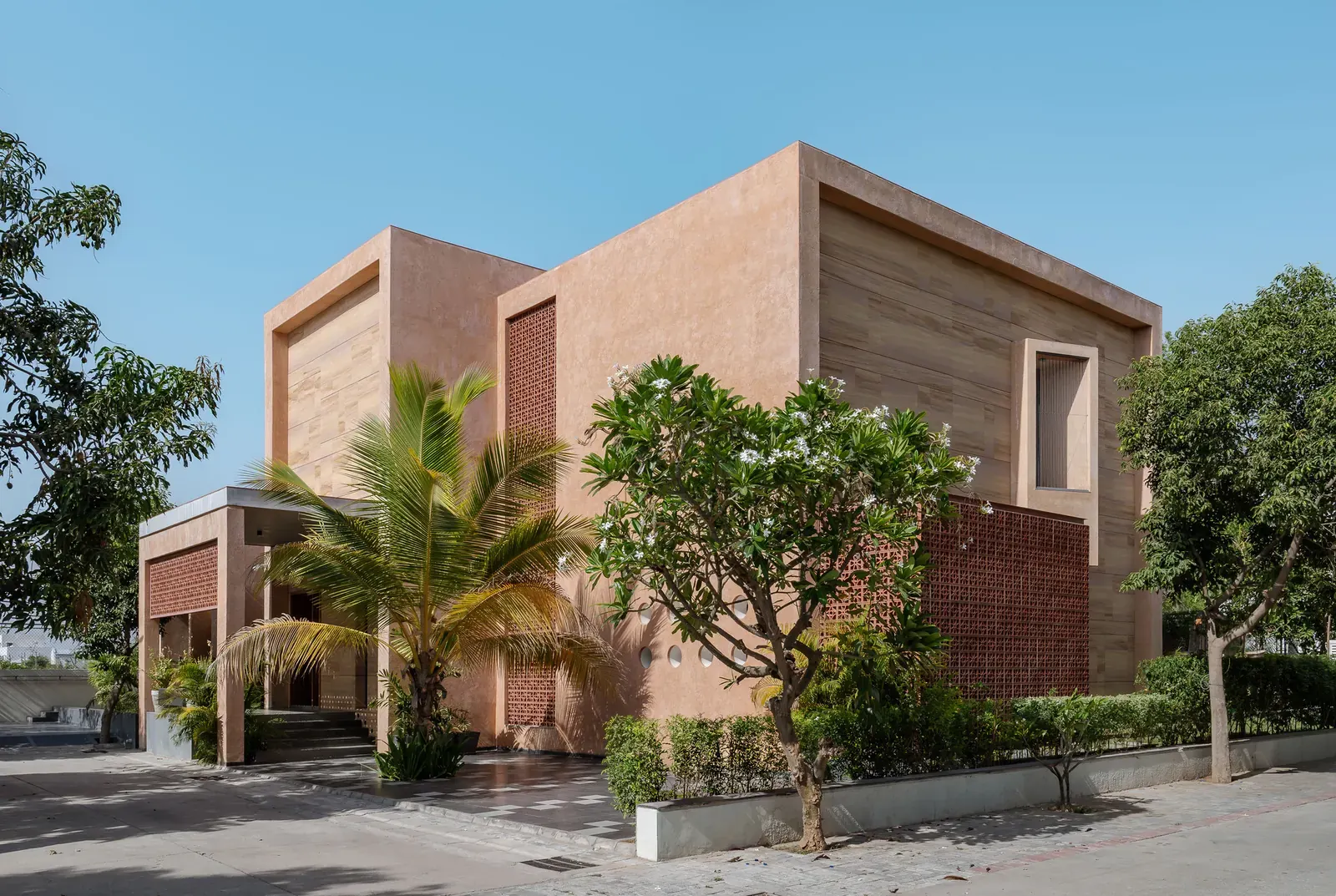 Exterior view of the Neeti-Lime House, showcasing its integration with the arid landscape.