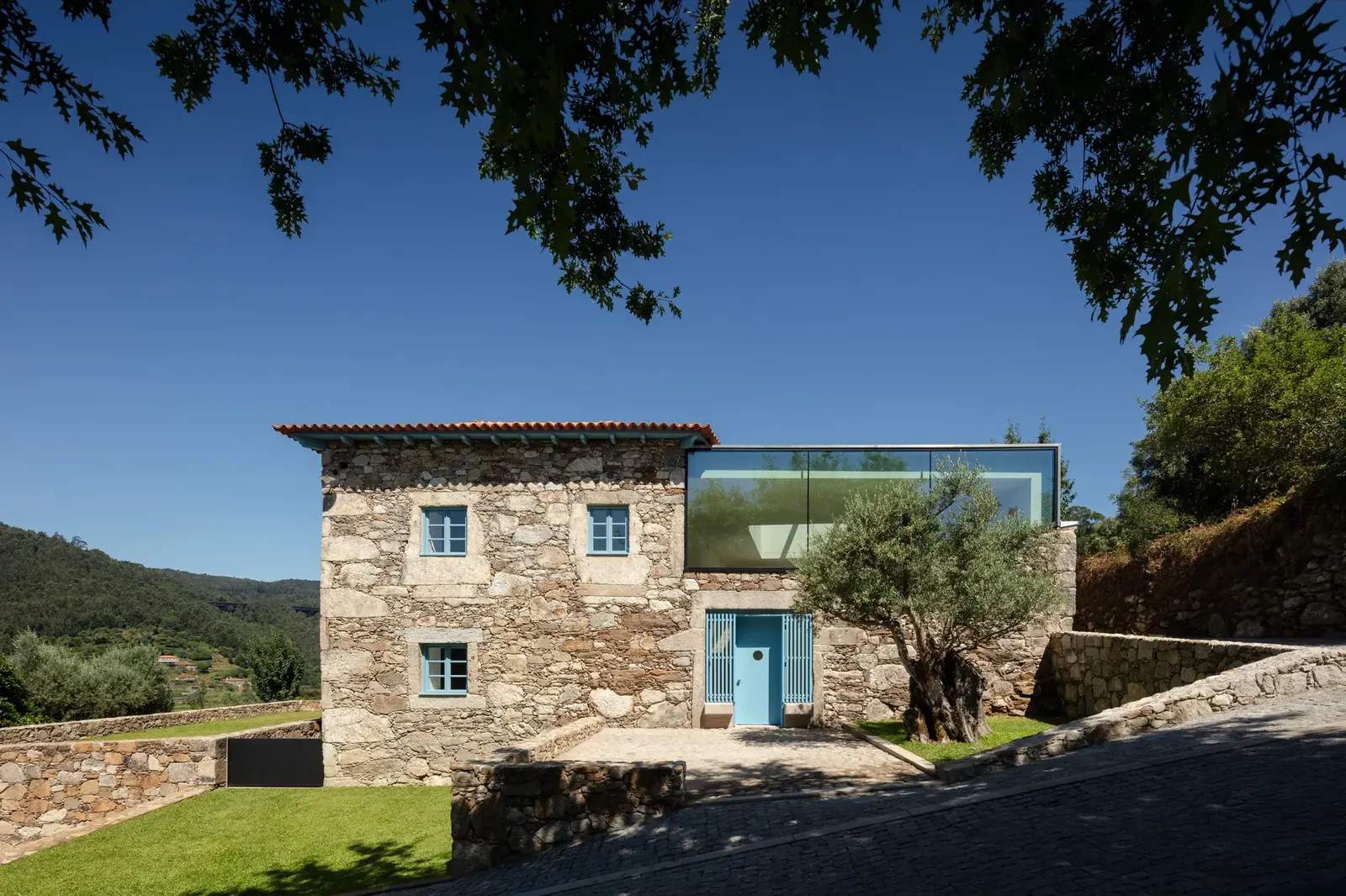The Cerdeiras House Hotel, a renovated 18th-century rural complex, features a blend of historic stone structures and contemporary additions.