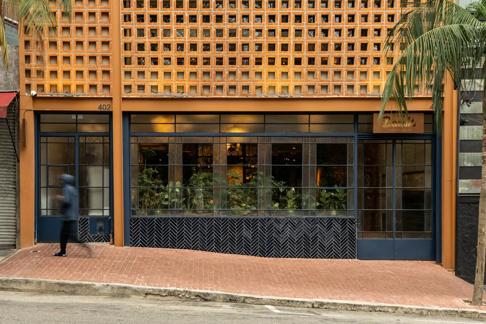Interior view of Casa Baruk restaurant featuring tactile materials and thoughtful spatial sequencing designed by Memola Estúdio in São Paulo.