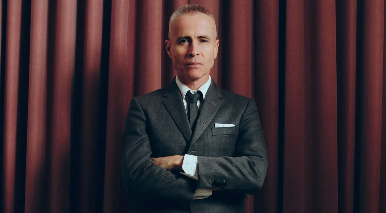 Thom Browne, the fashion designer, wearing his signature shrunken grey suit and tie.