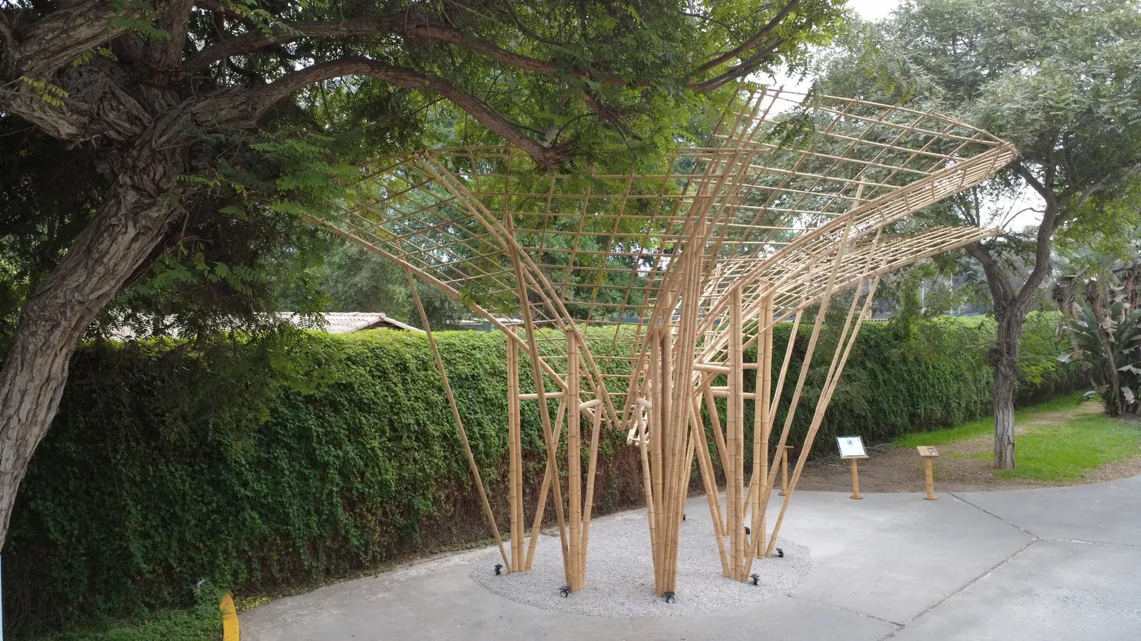 Exterior view of the Umbral Floral Pavilion, showcasing its integration of natural elements and architectural form.