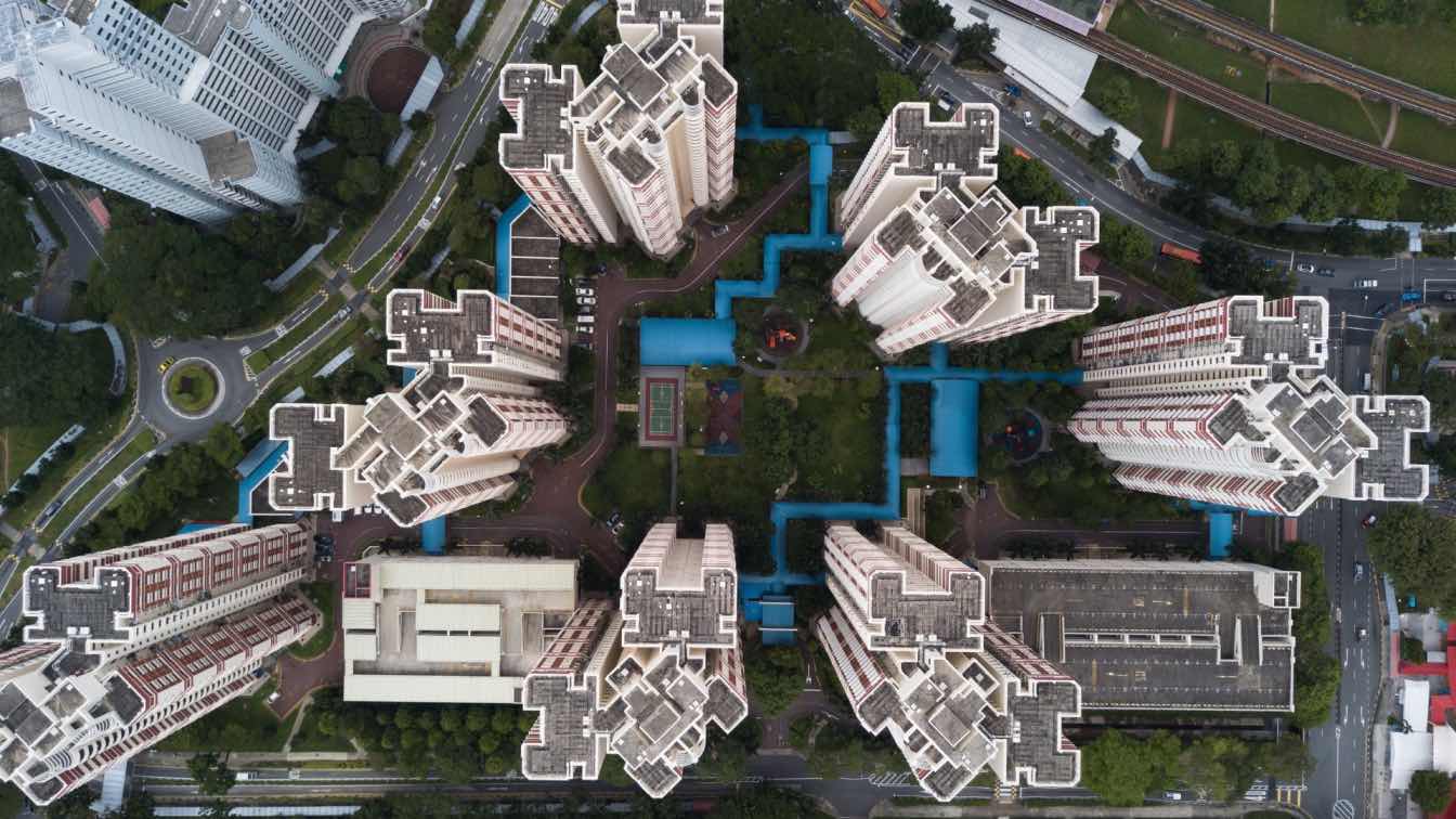 A futuristic city skyline where digital overlays and virtual interfaces are seamlessly integrated with physical architecture.