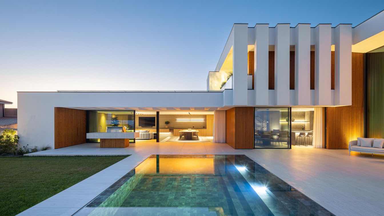 Casa FJ in Póvoa de Varzim, Portugal, a semi-detached residence by MIL870 and GRAUON with a pool terrace.