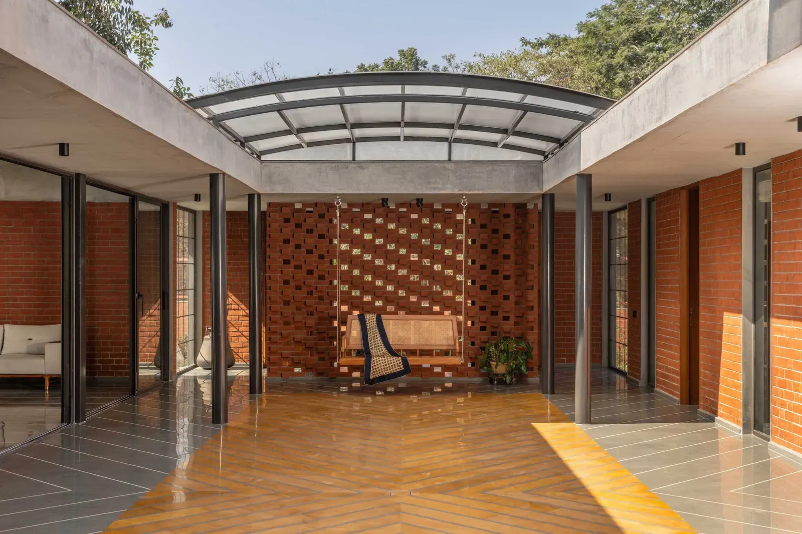 A view of the Malhaar Residence's central courtyard, showcasing its open-air design and surrounding living spaces.