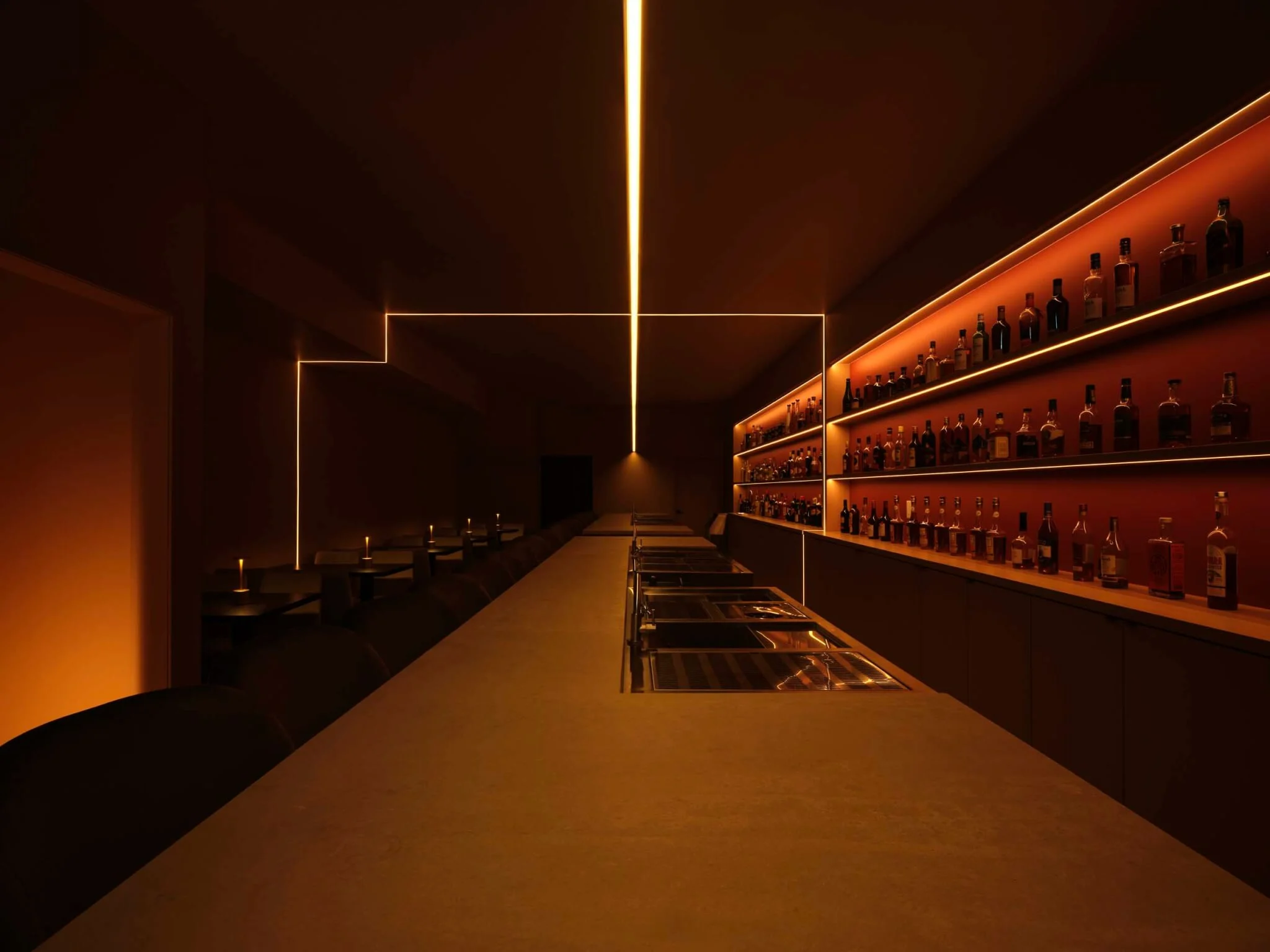 Red light spilling from the street-facing lounge of Suite 115 cocktail bar in Toronto, designed by Atelier SUN