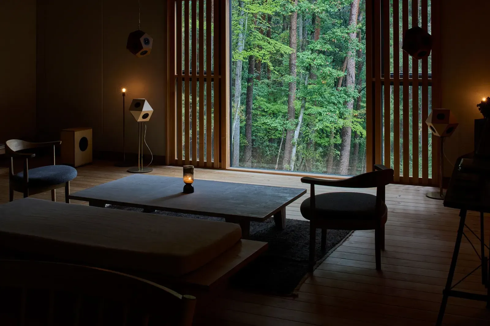 Exterior of Listude’s new headquarters in Hokuto, Yamanashi, a wooden building nestled among red pines, designed by Hitotomori Architects