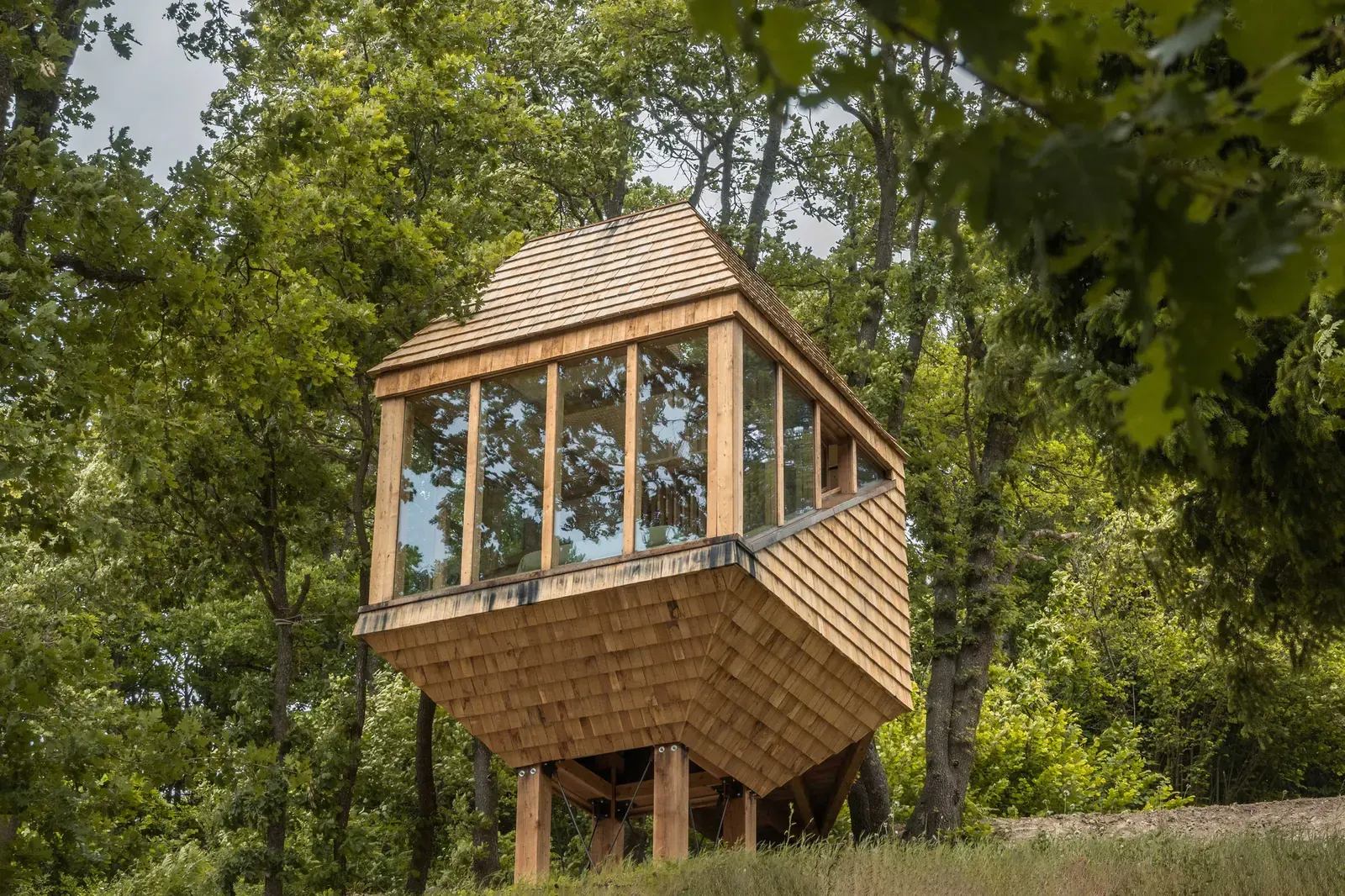 Exterior view of the TreeBOX wooden cabin nestled in the Ligurian-Piedmontese Alps by Studio Officina82.