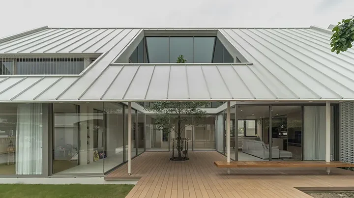 Bhoon+ House in Bangkok centers family life around a planted courtyard