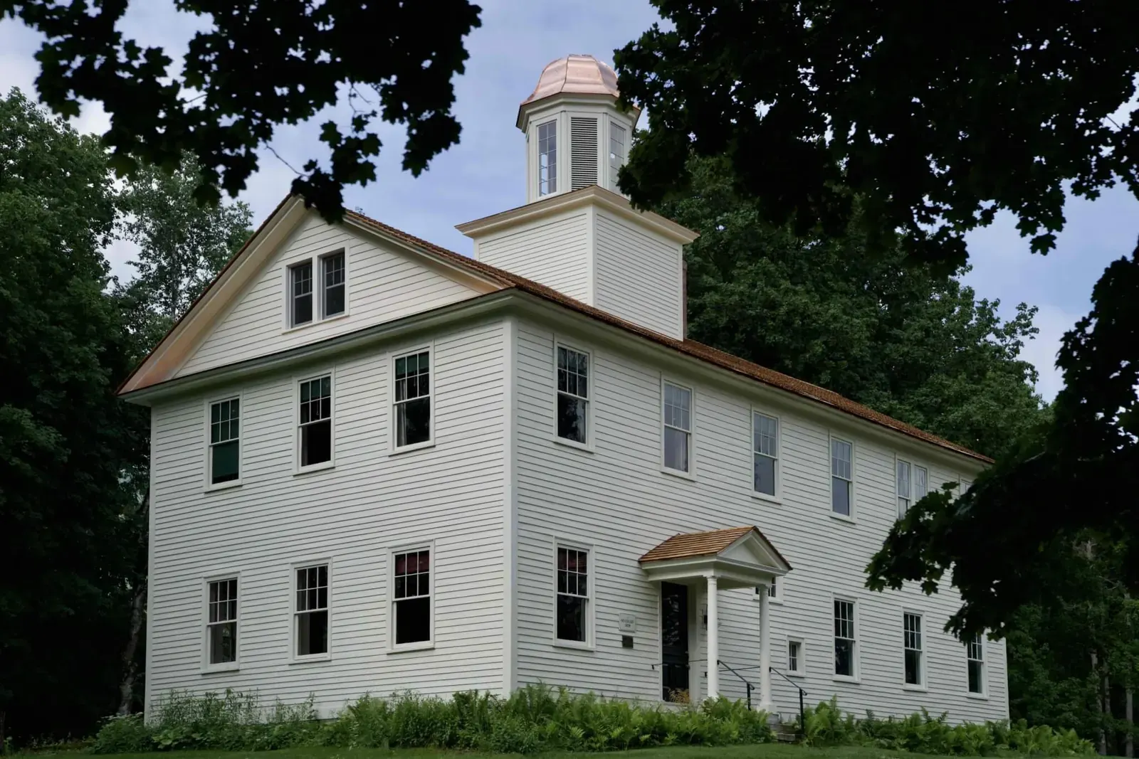 The Seminary, a restored 1829 historic building in Old Bennington, Vermont, now operating as a six-room boutique hotel under the Place in Mind hospitality group
