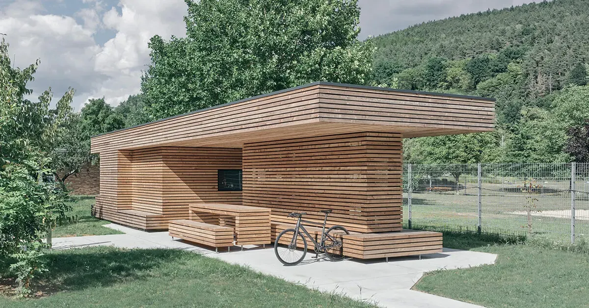 ToB.Studio’s Timber Bike Station in Burgsinn Echoes a Stacked Log Pile